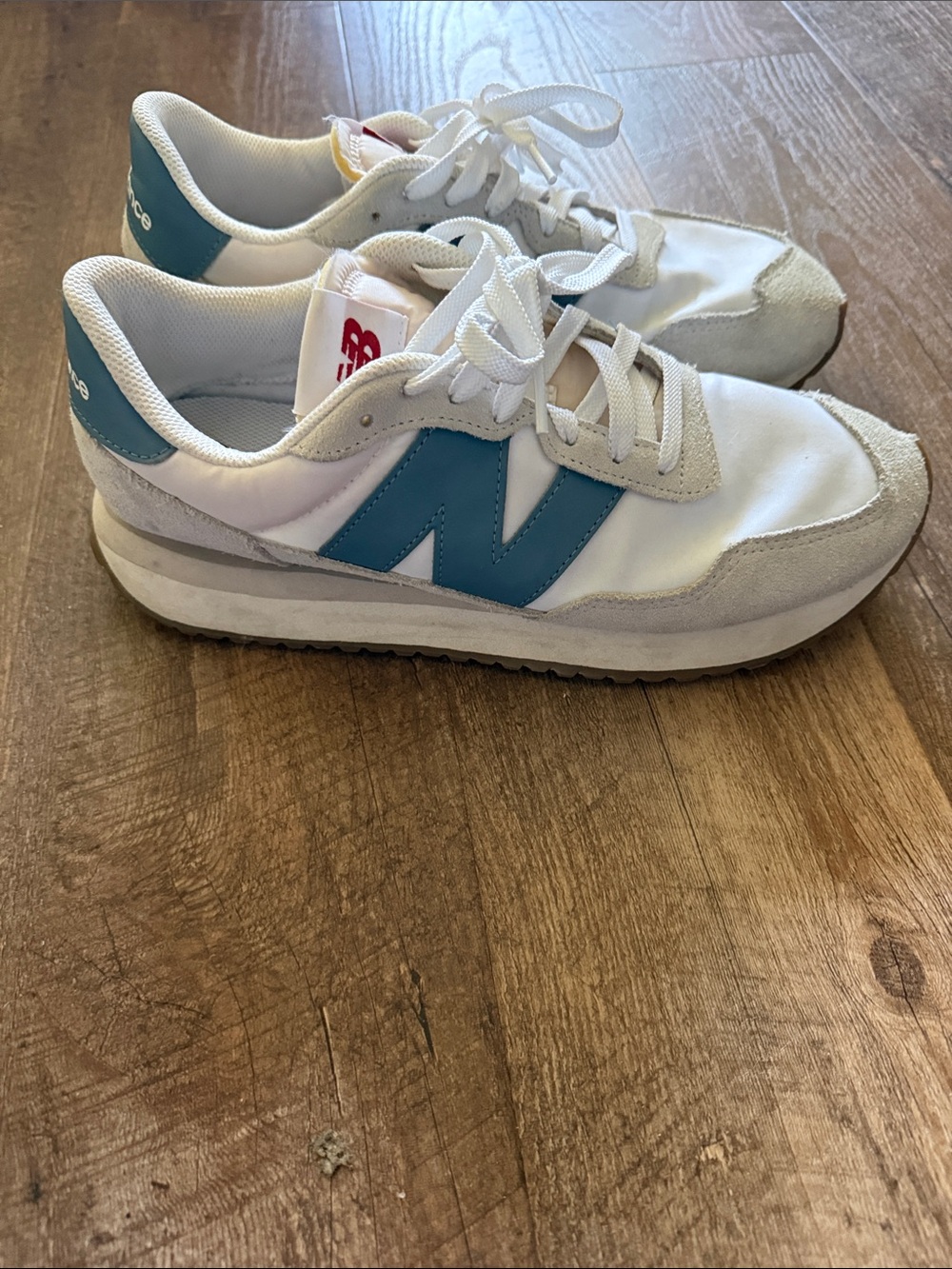 New Balance White Sneakers with Blue 'N' Logo